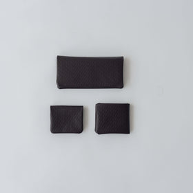 COSMIC WONDER monogram embossed light leather bifold coin case