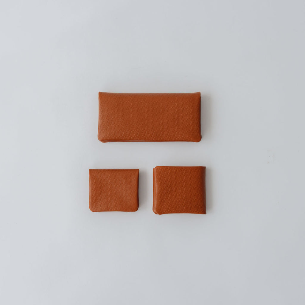 COSMIC WONDER monogram embossed light leather wallet